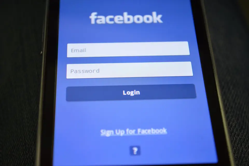 Social network login screen on a phone, the kind of profile link that fills a spam profile