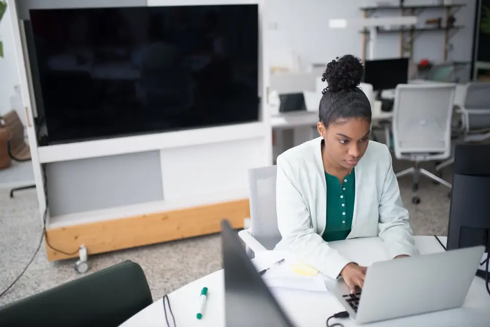 Journalist working in a newsroom, representing targeted media outreach