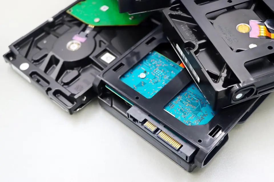 Disassembled disc drive and circuit board, where file size is measured in real space