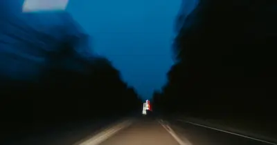 Open road at speed, motion-blurred